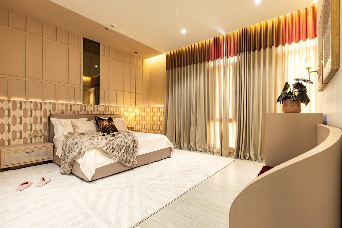 Master bedroom with gradient curtains and geometric wallpaper